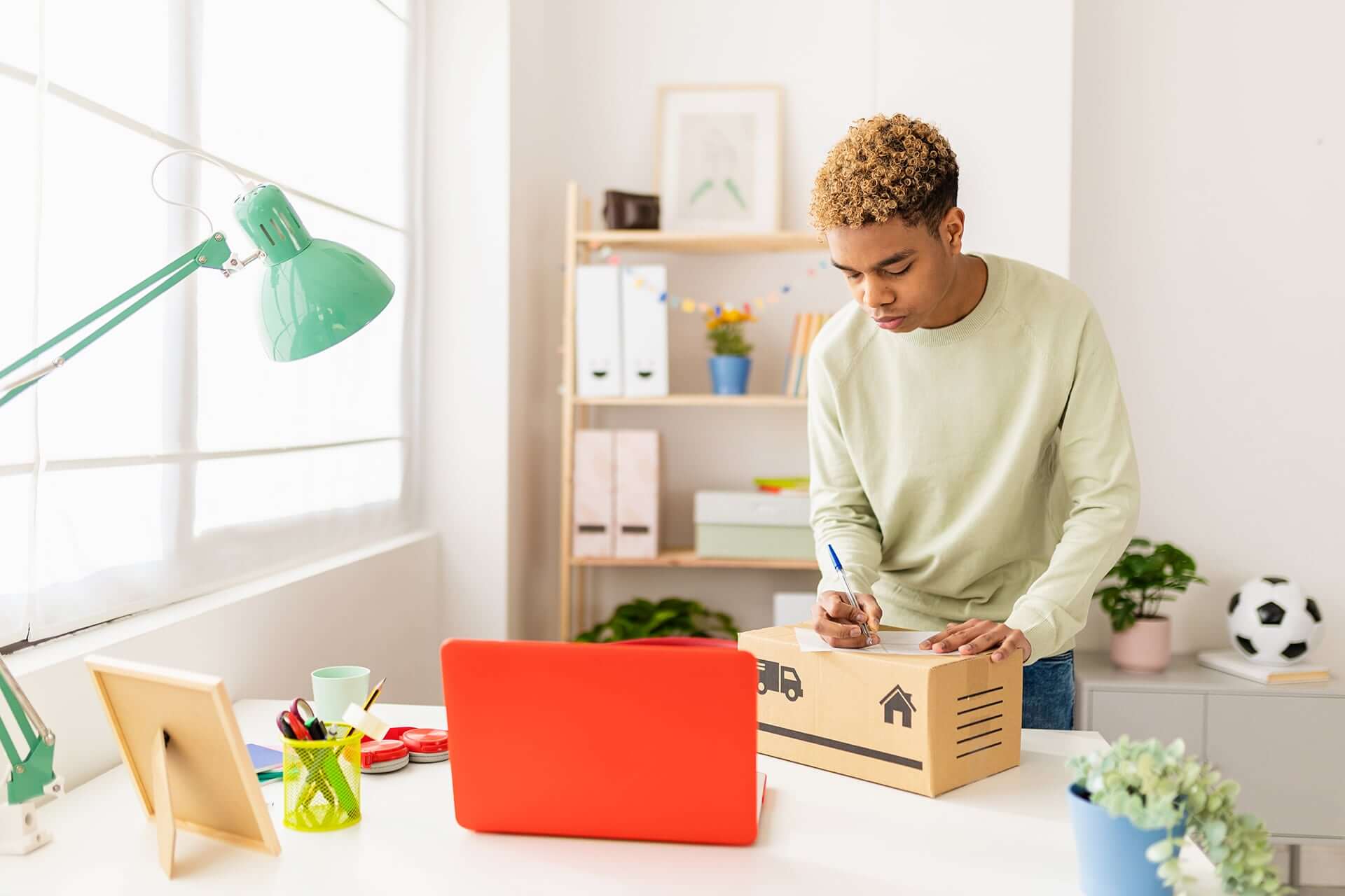 person writing on package